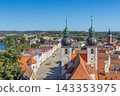 Aerial view of Telc with main square and towers of church of the Holy Name of Jesus, Czech Republic. 143353975