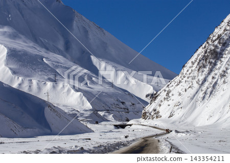 Winter Mountain Road Along the Snowy Georgian Military Highway in Caucasus 143354211