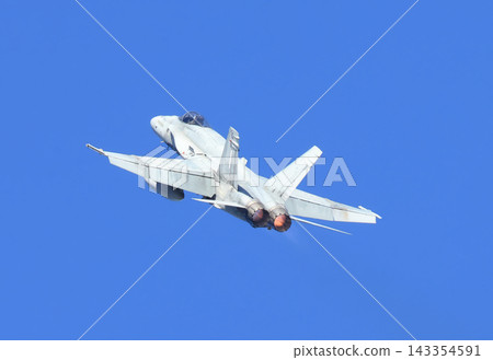 CF-18 Hornet Air Force fighter aircraft flying on a blue sky background CF-18 Hornet Air Force fighter aircraft flying on a blue sky background 143354591