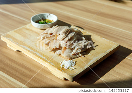 Traditional Jeju Style Boiled Pork Slices Dombe Gogi on Wooden Board Traditional Jeju Style Boiled Pork Slices Dombe Gogi on Wooden Board 143355317