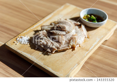 Traditional Jeju Style Boiled Pork Slices Dombe Gogi on Wooden Board Traditional Jeju Style Boiled Pork Slices Dombe Gogi on Wooden Board 143355320