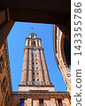 Tower of Laboral Ciudad de la Cultura framed by stone arch in Gijon Spain 143355786