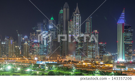 Dubai Marina skyscrapers and golf course day to night timelapse, Dubai, United Arab Emirates Dubai Marina skyscrapers and golf course day to night timelapse, Dubai, United Arab Emirates 143357206