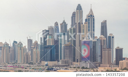 Dubai Marina skyscrapers and golf course morning timelapse, Dubai, United Arab Emirates Dubai Marina skyscrapers and golf course morning timelapse, Dubai, United Arab Emirates 143357208