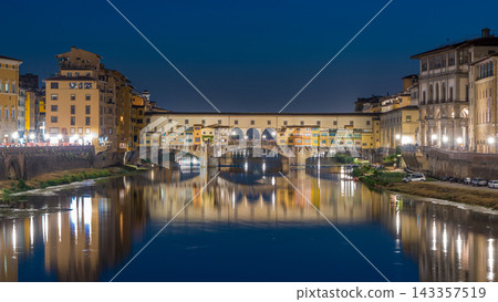 River Arno and famous bridge Ponte Vecchio day to night timelapse after sunset in Florence, Tuscany, Italy 143357519