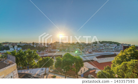 Sunrise over Lisbon aerial cityscape skyline timelapse from viewpoint of St. Peter of Alcantara, Portugal. Sunrise over Lisbon aerial cityscape skyline timelapse from viewpoint of St. Peter of Alcantara, Portugal. 143357593