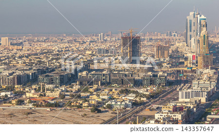 Skyscrapers and traffic on Sheikh Zayed Road aerial timelapse in Dubai, UAE. Skyscrapers and traffic on Sheikh Zayed Road aerial timelapse in Dubai, UAE. 143357647