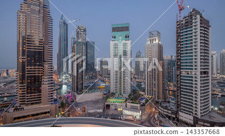 Beautiful aerial top view day to night transition timelapse of Dubai Marina canal Beautiful aerial top view day to night transition timelapse of Dubai Marina canal 143357668
