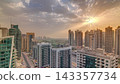 Sunrise view of various skyscrapers and towers in Dubai Marina from above aerial timelapse 143357734