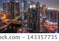 Aerial view of Dubai Marina residential and office skyscrapers with waterfront day to night timelapse 143357735