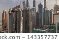 View of various skyscrapers and towers in Dubai Marina from above aerial timelapse 143357737