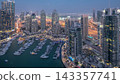 Aerial top view of Dubai Marina day to night timelapse. Modern towers and traffic on the road 143357741