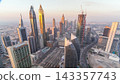 Skyline view of the buildings of Sheikh Zayed Road and DIFC aerial timelapse in Dubai, UAE. 143357743