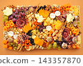 Halloween charcuterie board fun food mix: ghosts, mummies, pumpkins, eyes, brooms. Party spooky salty snacks 143357870