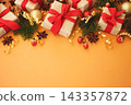 Gifts and present boxes on fir branches, pines, red berries background; festive Christmas and New Year celebration card 143357872