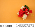 Gifts and present boxes on fir branches, pines, red berries background; festive Christmas and New Year celebration card 143357873