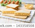 freshly made egg salad sandwiches on a white table, selective focus. 143358508