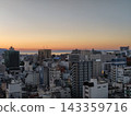 Takamatsu city bathed in the sunset, with a view towards Takamatsu Port. 143359716