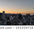 Takamatsu city bathed in the sunset, with a view towards Takamatsu Port. 143359718