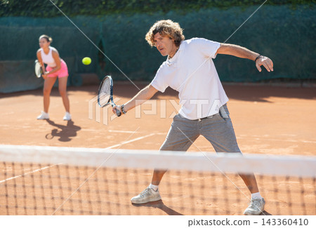 woman plays tennis with a fly woman 143360410