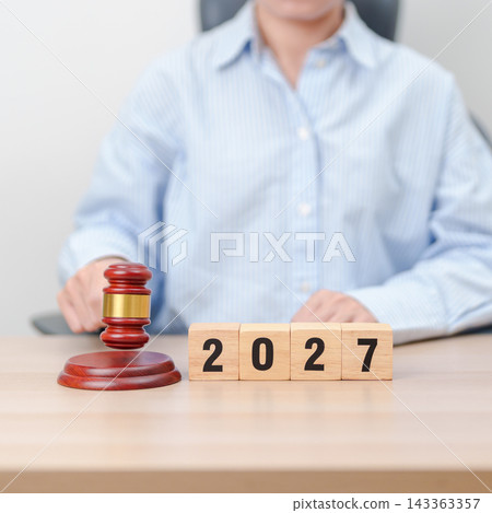 Happy New Year 2027 with judge gavel on table. Law, lawyer, judgment, justice auction and bidding concept 143363357