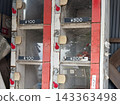 Traditional sales shelves and price displays at a farmers' market. 143363498