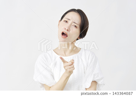 Angry middle-aged woman, complainer, white background Angry middle-aged woman, complainer, white background 143364087