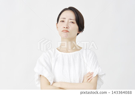 Middle-aged woman, angry, white background. Middle-aged woman, angry, white background. 143364088