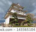 Marugame Castle stands under a cloudy sky. 143365104