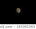 moon floating in the night sky 143365263