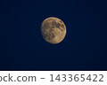 moon floating in the night sky 143365422
