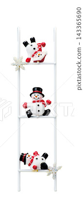 A Christmas decoration featuring three snowman figurines on a white ladder, accented with snowflakes, against a white background. A Christmas decoration featuring three snowman figurines on a white ladder, accented with snowflakes, against a white background. 143365690