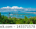 Sanya city panorama with Phoenix Island skyscrapers, ocean harbor, boats, and coast seen from Luhuitou Park in Hainan, China 143371578