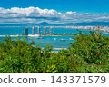Panoramic aerial view of Sanya city skyline, Phoenix Island luxury hotels, and bay from Luhuitou Park viewpoint, Hainan, China 143371579
