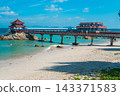 Wuzhizhou Island beach in Sanya Hainan with bridge, pagoda pavilion, turquoise ocean water, and sand coast. Tropical China travel resort 143371583