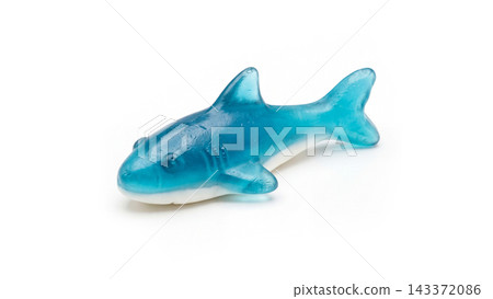 Blue and white shark shaped gummy candy isolated on white background with translucent isolated background confectionery delicious confection colorful predator commercial photography 143372086