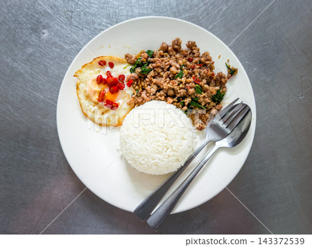 Rice topped with pork with Thai basil and fried egg Rice topped with pork with Thai basil and fried egg 143372539