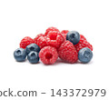 Ripe raspberry and blueberries on white backgrounds 143372979