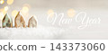 Ceramic figurines of houses in the snow. 143373060