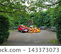 A sprawling green garden and a Halloween car display 143373073