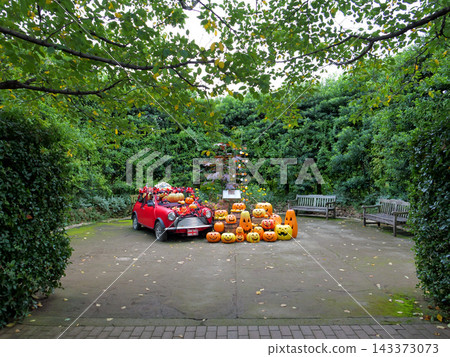 A sprawling green garden and a Halloween car display A sprawling green garden and a Halloween car display 143373073