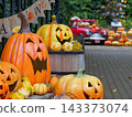 Autumn garden decorations featuring jack-o'-lanterns 143373074