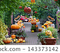 Autumn garden pathways adorned with greenery and pumpkins 143373142