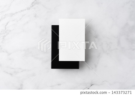 Blank white business cards and close black aluminum card holder on white marble background, top view flat lay with copy space Blank white business cards and close black aluminum card holder on white marble background, top view flat lay with copy space 143373271