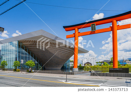 (3:2) A view of the Shizuoka Prefectural Mt. Fuji World Heritage Center and a large red torii gate under a clear blue sky in Fujinomiya City, Shizuoka Prefecture. (3:2) A view of the Shizuoka Prefectural Mt. Fuji World Heritage Center and a large red torii gate under a clear blue sky in Fujinomiya City, Shizuoka Prefecture. 143373713
