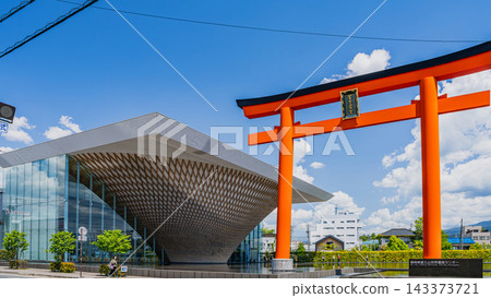 (16:9) A view of the Shizuoka Prefectural Mt. Fuji World Heritage Center and a large red torii gate under a clear blue sky in Fujinomiya City, Shizuoka Prefecture. (16:9) A view of the Shizuoka Prefectural Mt. Fuji World Heritage Center and a large red torii gate under a clear blue sky in Fujinomiya City, Shizuoka Prefecture. 143373721