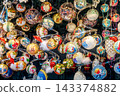 Colorful festive holiday glass balls collection at the Christmas market in Vienna, Austria. 143374882
