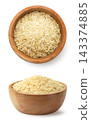 Raw rice in a wooden bowl close-up on a white background. Isolated 143374885