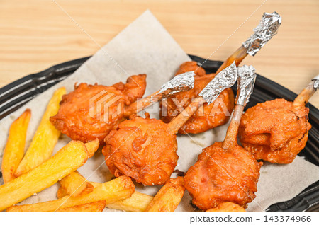 Tulip chicken and french fries Tulip chicken and french fries 143374966