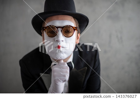 Close up portrait of a sad male mime wearing double glasses Close up portrait of a sad male mime wearing double glasses 143376027